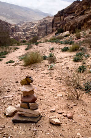 Path with bedouin sign made of stones in Petra, Jordanの写真素材