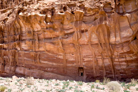 Small door in a big rock near the Monastery. Petra, Jordanの写真素材