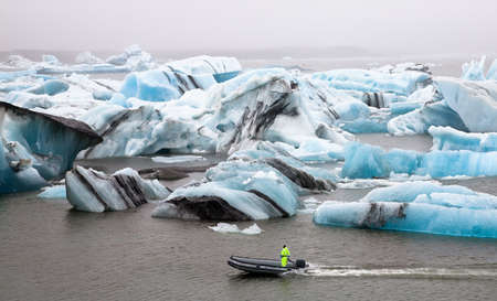Inflatable boat in the Jokulsarlon Glacier Lagoon, Southern Icelandの写真素材