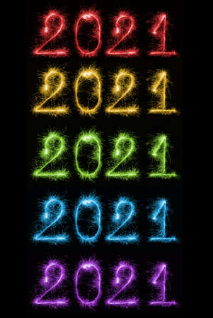 Set of colorful sparkling burning numbers Year 2021 on black background for design holiday web banner and greeting card. Numbers made of Bengal lights. Happy New Year 2021 theme.の写真素材