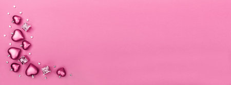 Valentines Day greeting card with hearts and gift boxes on pink background. Top view with empty space for your text. Flat lay, copy spaceの写真素材