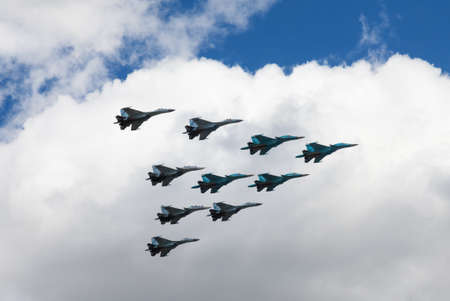 May 7, 2021, Russia, Moscow. Group of Air Force jet fighters The Russian Knights performs demonstration flight in the sky over the city. Rehearsal for the Victory Parade on May 9.のeditorial素材