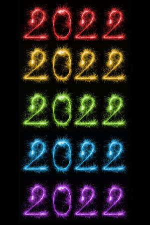 Set of colorful sparkling burning numbers Year 2022 on black background for design holiday web banner and greeting card. Numbers made of Bengal lights. Happy New Year 2022 theme.の写真素材