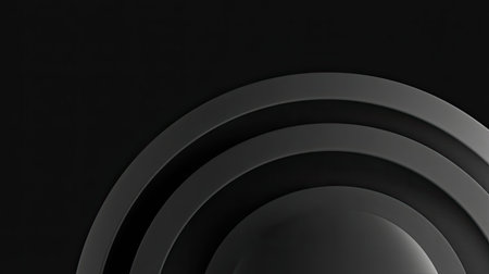A minimalist and modern composition featuring abstract circular shapes in shades of black and gray against a dark background, ideal for creative projects.の素材