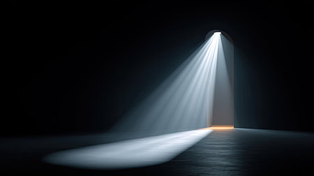 A captivating image of light streaming through an open doorway in a dark room evokes feelings of mystery and intrigue, inviting exploration of the unknown.の素材