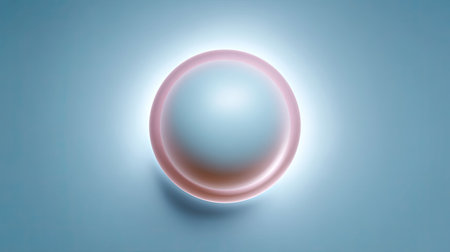 A minimalist design featuring a softly glowing sphere on a light blue background. The subtle halo effect adds depth and tranquility, perfect for artistic projects.の素材