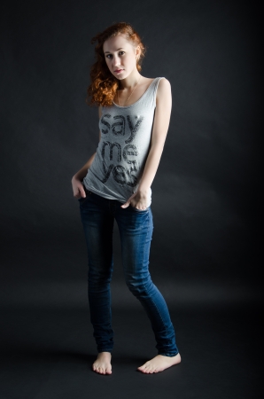 Red-haired beauty portrait against black backgroundの写真素材