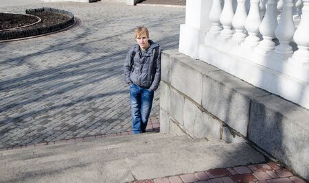 Male student portrait in the streetの写真素材