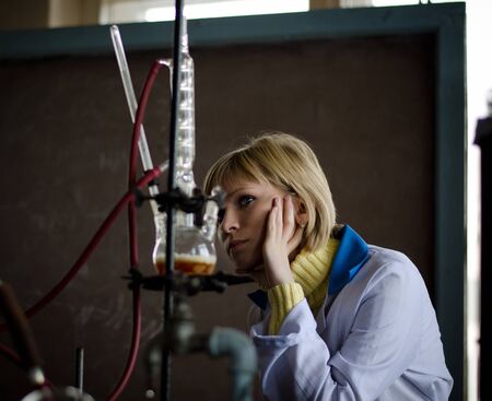 Students of chemical department carrying out an experiment  Assembling a cooler の写真素材
