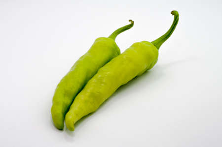 the selective focus of chili over white background. healthy diet concept.の写真素材