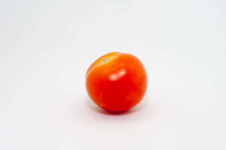 the selective focus of tomato over white background. healthy diet concept.の写真素材
