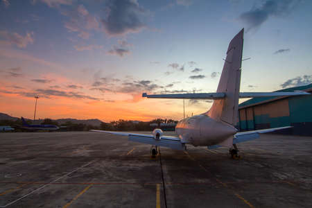 Small aircraft at the beautiful sunriseの写真素材