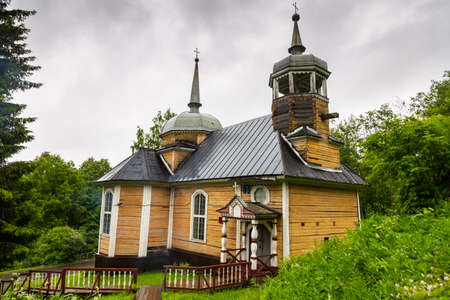 old wooden church in Karelia in summer in the forestの写真素材