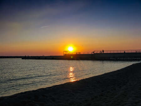 orange sunset over the bay and the mallの写真素材