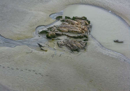 pilgrim went to sea at low tide and disappeared Mont Saint-Michel, Franceの写真素材