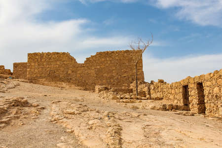 fragments of the ancient wall of the fortress of Masada in Israelの写真素材