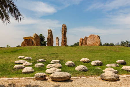 stone pillars stand in a circle in a park in Israelの写真素材