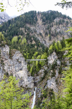 suspension pedestrian bridge over the gorge near the Neuschwanstein castle in Bavariaのeditorial素材