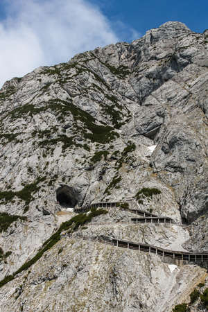 View of a zigzaging mountain road leading to the eisriesenwelt ice cave Eisriesenwelt in Austria.の写真素材