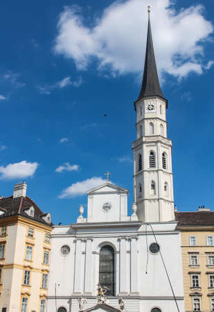 clock tower on the building of the Church of St. Michael in Vienna Austriaの写真素材