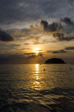 View of Koh Pu island at sunset from Kata Phuket beach, Thailandの写真素材