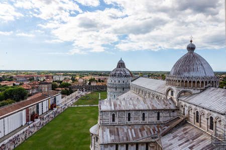 View of the Cathedral of Pisa from the top of the Famous Leaning Tower in the city of Pisa, Italyの写真素材