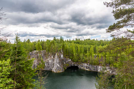 Bright Lake is a former quarry where marble was mined under a blue sky with clouds, Karelia. Russiaの写真素材