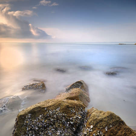 A peaceful morning at the rocky beach, Kuantan, Pahang, Malaysiaの写真素材