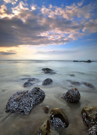 A peaceful morning at the rocky beach, Kuantan, Pahang, Malaysiaの写真素材