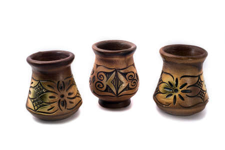 Three vase make from clay with beautiful sculpture and color put side by side forming a curve isolated on white backgroundの写真素材