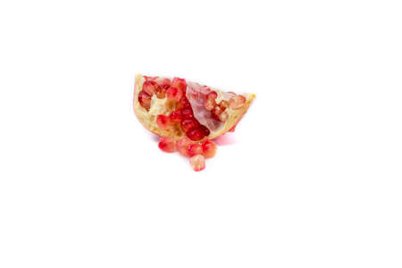 A quarter cut pomegranate isolated on white backgroundの写真素材