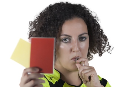 woman dressed as a referee with a whistle and card in handの写真素材