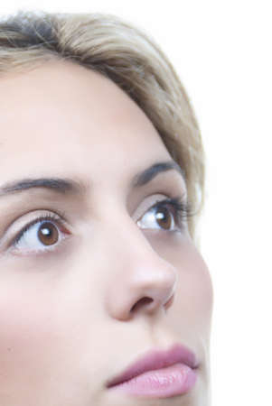 beautiful woman looking up with brown eyesの写真素材