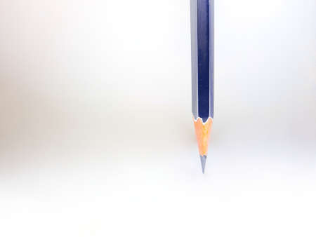 grey Black wooden pencil on white background, School stationery.の写真素材