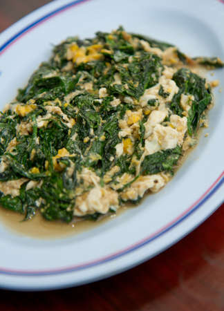 Melinjo fried with egg and garlicの写真素材