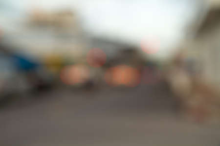 Abstract urban background with blurred buildings and street, shallow depth of focusの写真素材
