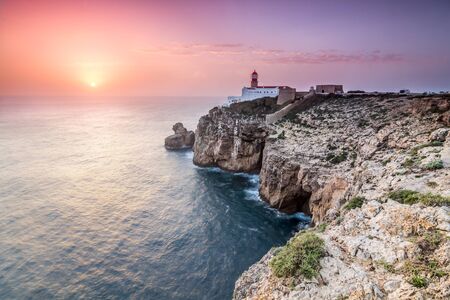 View of the lighthouse and cliffs at Cape St. Vincent at sunset. Picture taken in Sagres, Algarve, Portugal.の写真素材