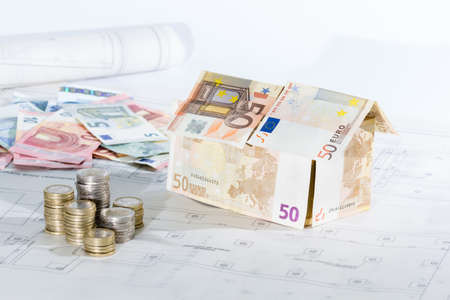 house made of money-European Union banknotes, architectural plans and moneyの写真素材