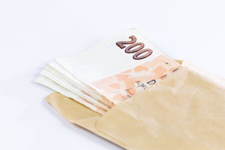 Two hundred Czech crowns in an envelope isolated on white background