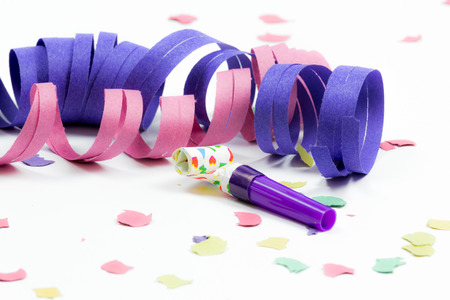 confetti, streamers and party blower on white backgroundの写真素材
