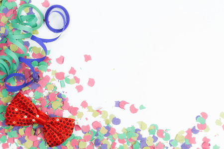confetti, streamers and red bow on white backgroundの写真素材