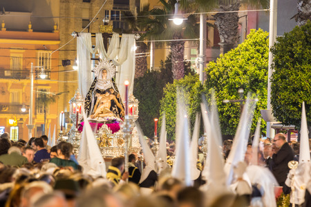 Holy Week in San Fernando, Cadiz, Spain. Brotherhood of charity during the procession of Easter.のeditorial素材