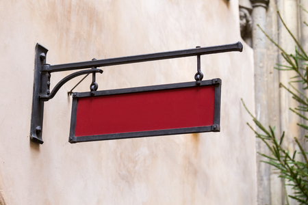 Blank mock-up iron vintage street signboard in european old townの写真素材