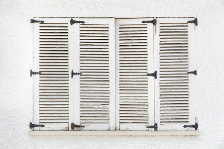 vintage window, Old wooden window on white wall background in Cadiz, Spainの写真素材