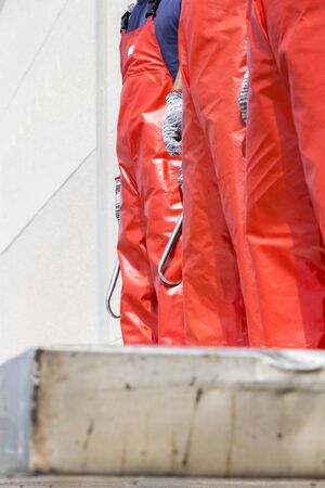 Fishermen waiting for the arrival of the ship loaded with Atlantic Bluefin tuna to download and process them. Barbate, Cadiz, Andalusia, Spain.の写真素材