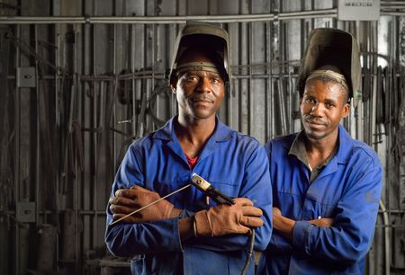 South African or American black workers or welders in factoryの写真素材