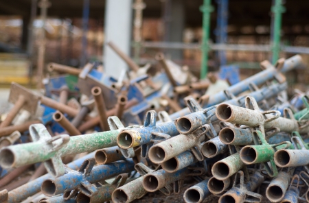 Pile of old construction scaffold on siteの写真素材