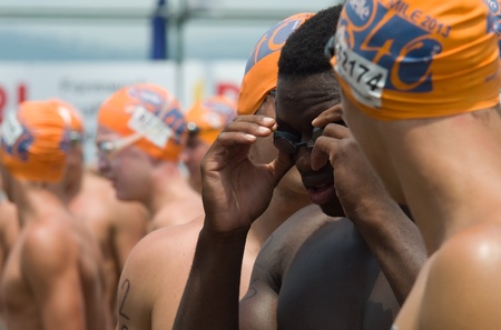 MIDMAR DAM - 10 FEBRUARY 2013: Unidentified swimmers prepare to participate in the main swimming event of the Midmar Mile near Howick, KwaZulu-Natal, South Africa.のeditorial素材
