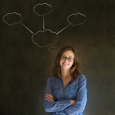 Thinking business woman with chalk cloud thoughts on blackboard background