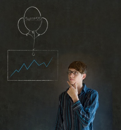 Business man, student or teacher with chalk success graph and balloon on blackboard backgroundの写真素材